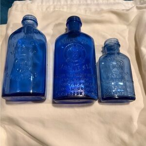 Vintage set of 3 different milk of magnesia bottles